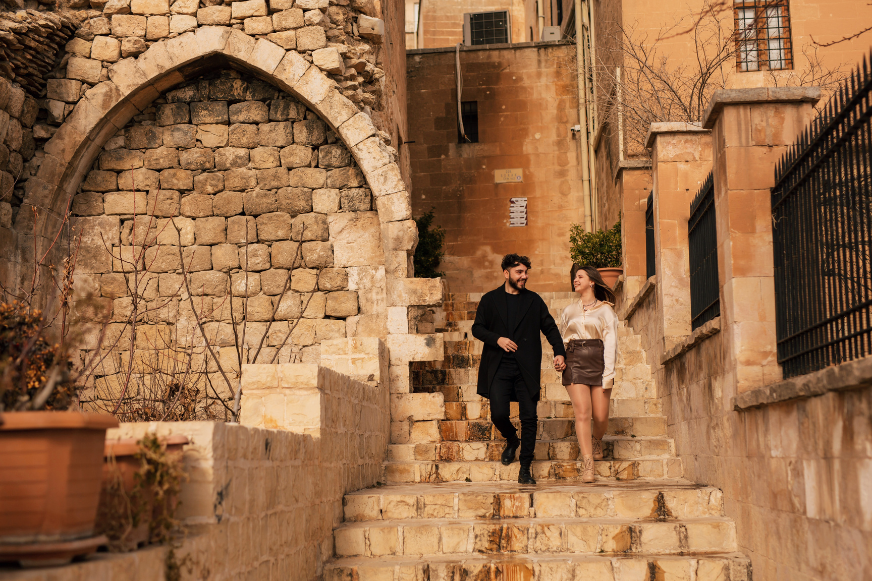 Couple Traveling the Alley in Mardin While Holding Hands