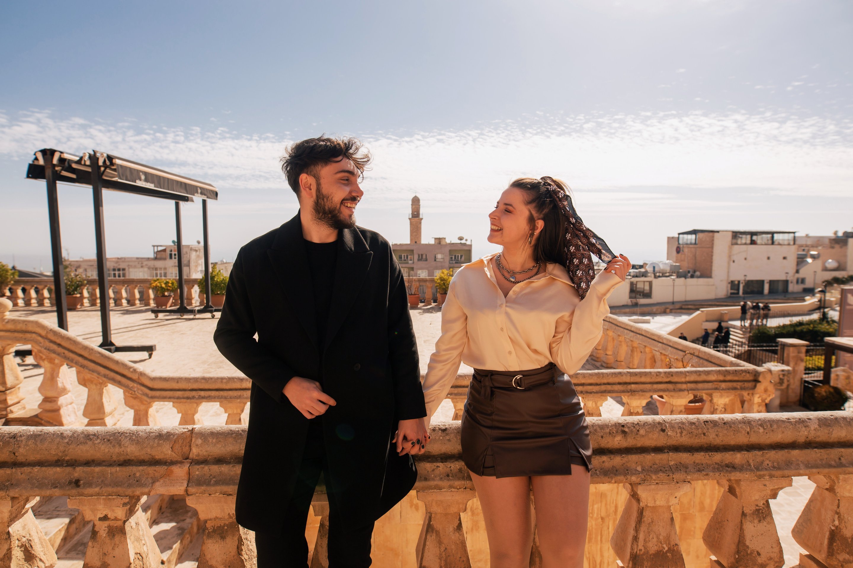 Smiling Couple Holding Hands in a Viewpoint in Mardin