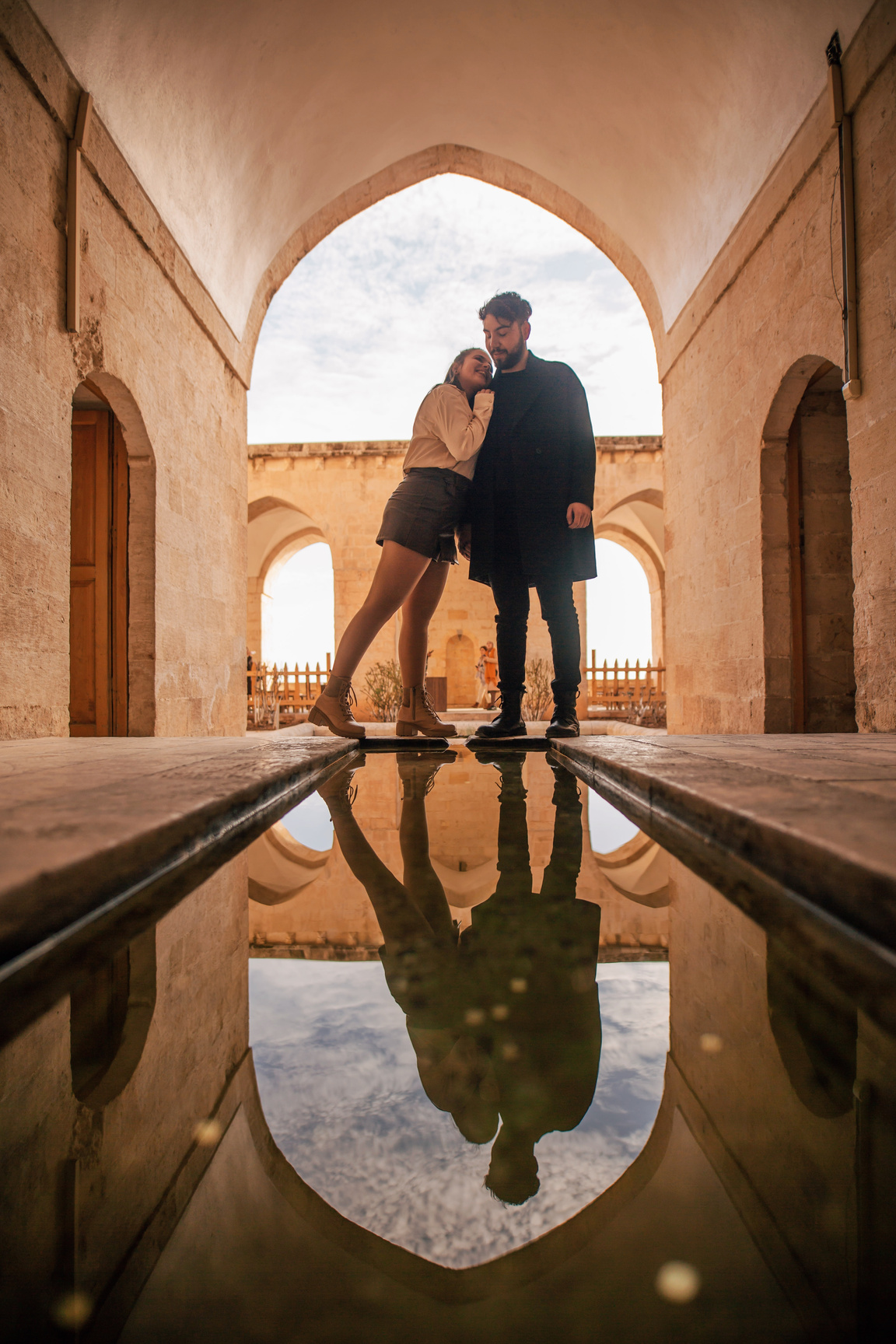 Romantic Couple inside the Building Reflected on Water